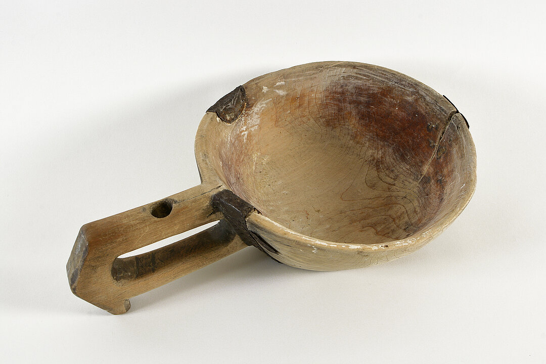 
Old wooden dough bowl with handle
