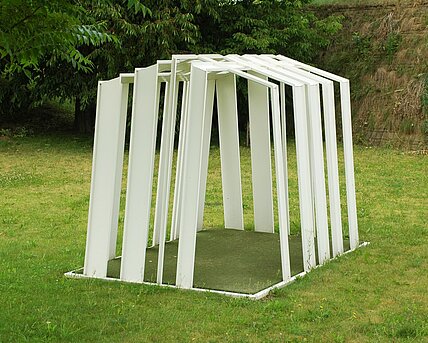 Erjautz constructs his sculpture as a building or tent made of white lines that have become metal, derived from computer bar codes. 