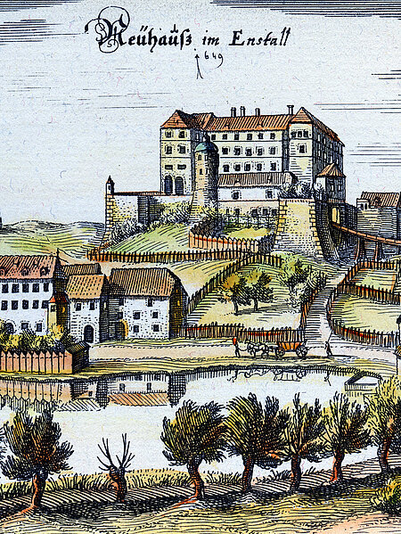 Historical representation (copper engraving) of Trautenfels Castle, which stands on a hill. Below there are many houses and a lake with trees. Above it is the old name of Trautenfels Castle "Neuhaus im Ennstall 1649"